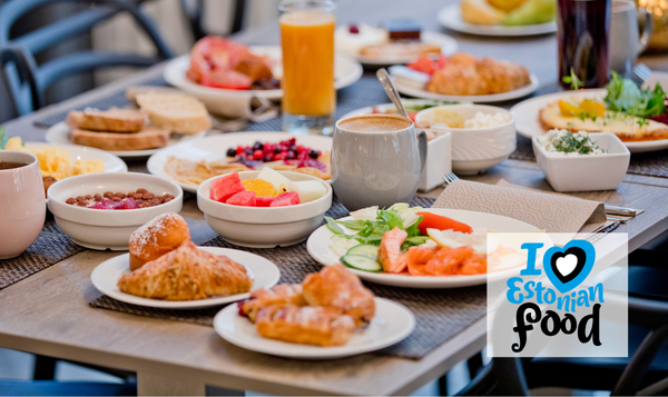 HS pilt I love Estonian food The photo shows breakfast at Nordic Hotel Forum, featuring a variety of dishes including fish and pastries, muesli, fresh fruit, and coffee. Additionally, there is an 'I love Estonian food' label.